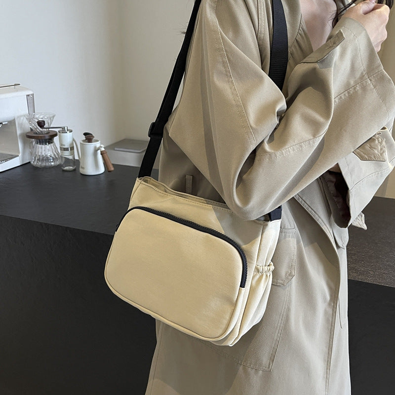 Practical shoulder bag with versatile storage compartments