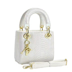 Ladies elegant mini handbag in modern snakeskin look with removable shoulder strap
