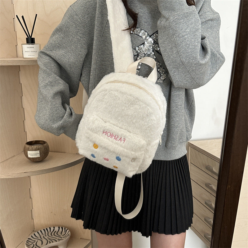 Plush backpack with playful design