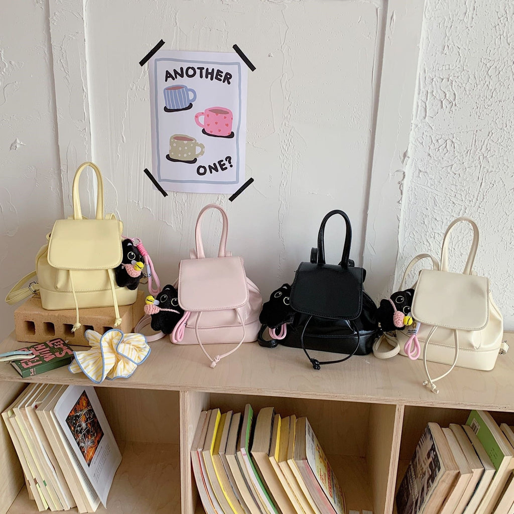Women's mini backpack with playful pendant