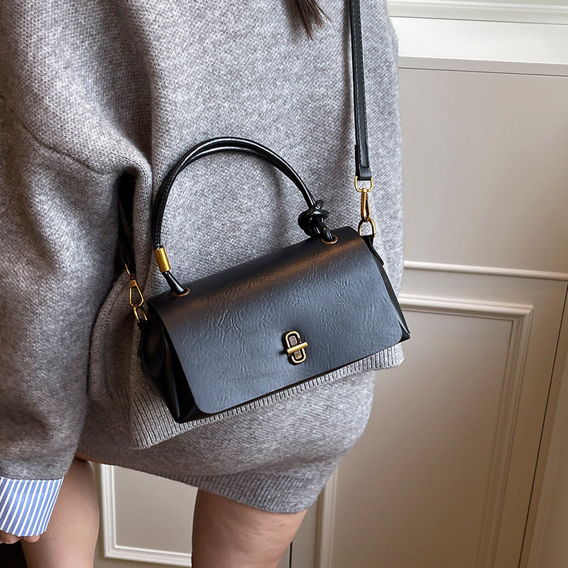Women's elegant handbag with detachable shoulder strap