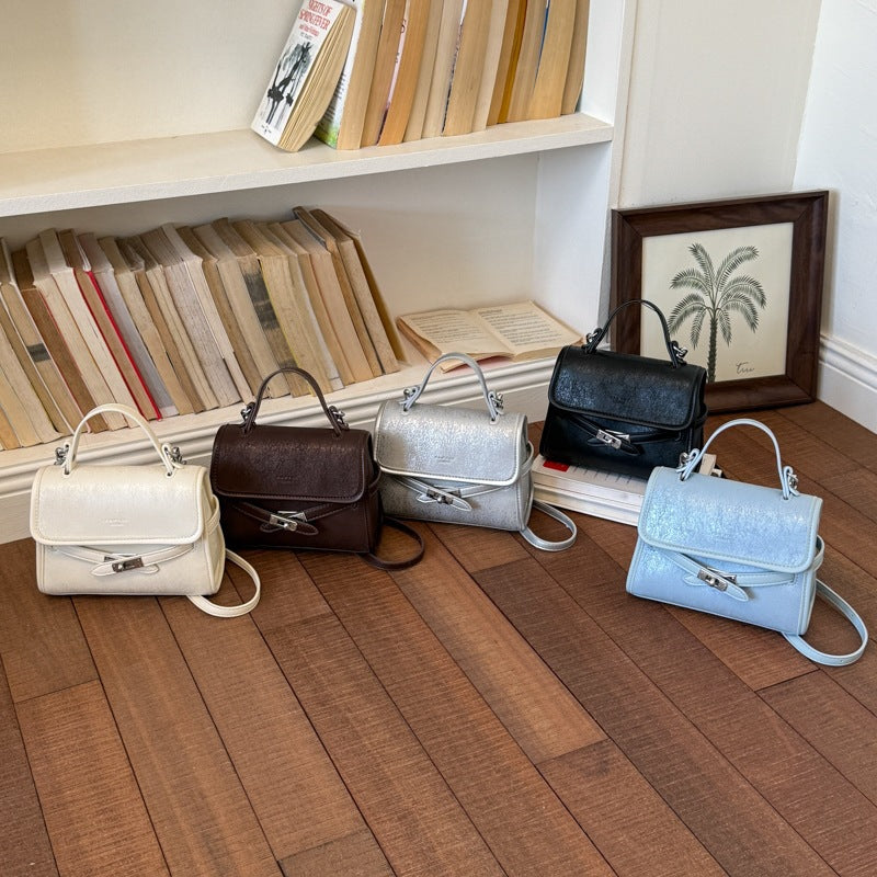 Ladies fashionable mini handbag with decorative magnetic closure