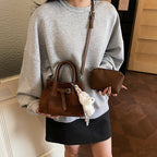 Women’s mini handbag with modern accents and practical interior organizer