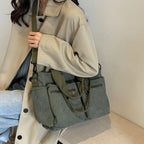 Durable shoulder bag with multiple compartments
