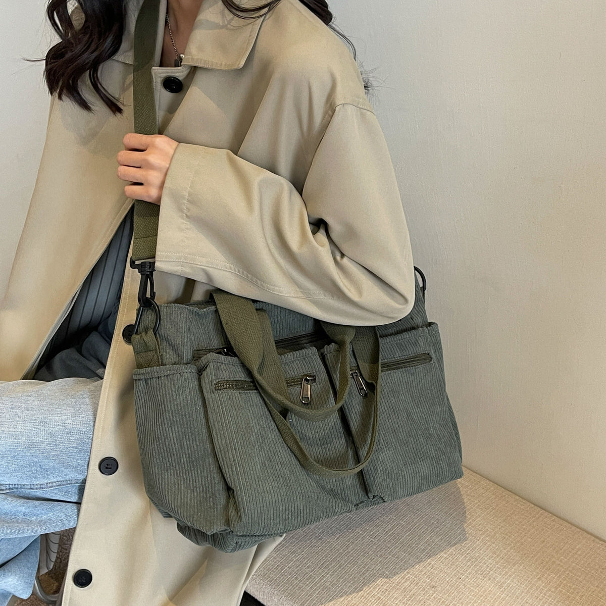 Durable shoulder bag with multiple compartments