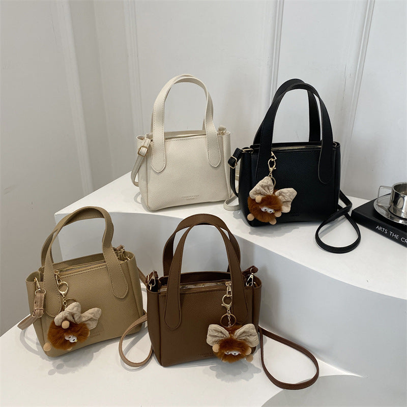 Women’s mini bag with playful animal pendant