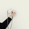 Women’s mini clutch with elegant chain strap and luxurious quilted pattern