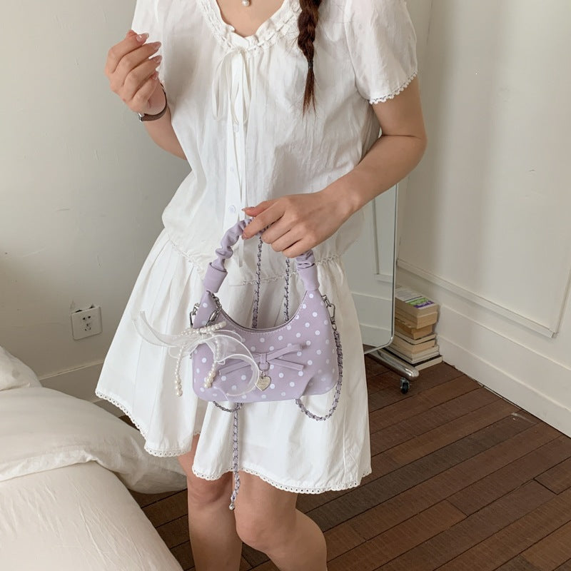 Women's mini handbag with decorative accents