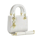 Ladies elegant mini handbag in modern snakeskin look with removable shoulder strap