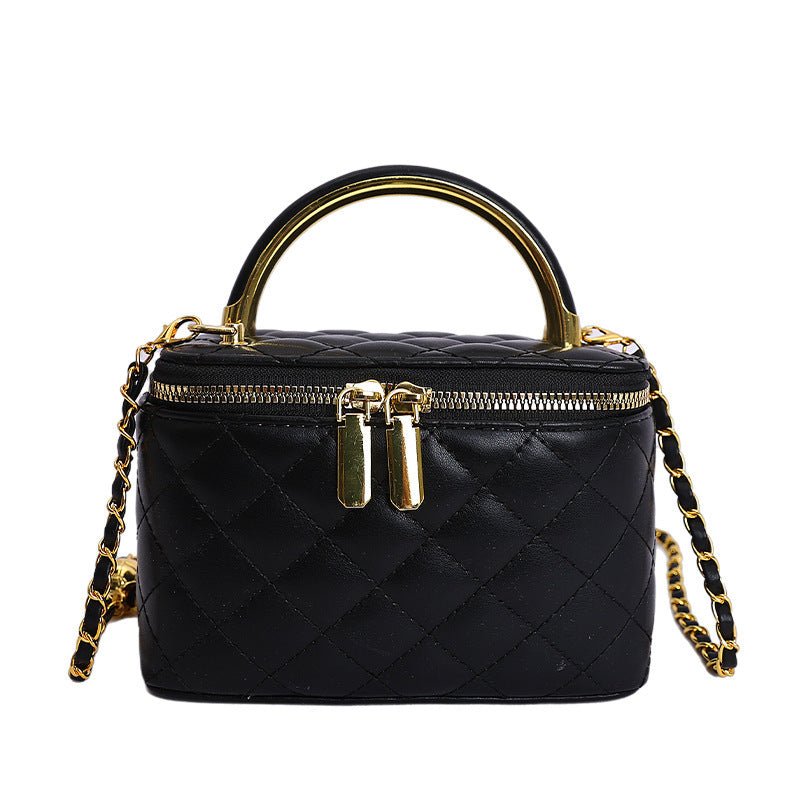 Women's mini handbag with gold chain accent and textured design
