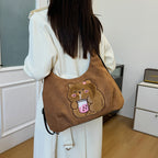 Shoulder bag with playful bear motif