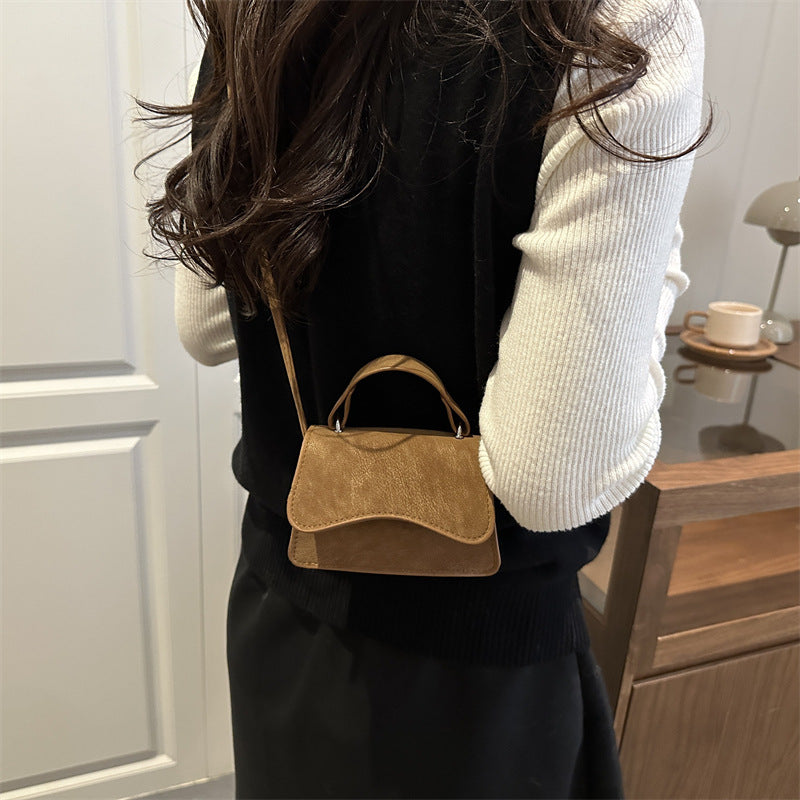 Women's mini handbag with removable carry handle
