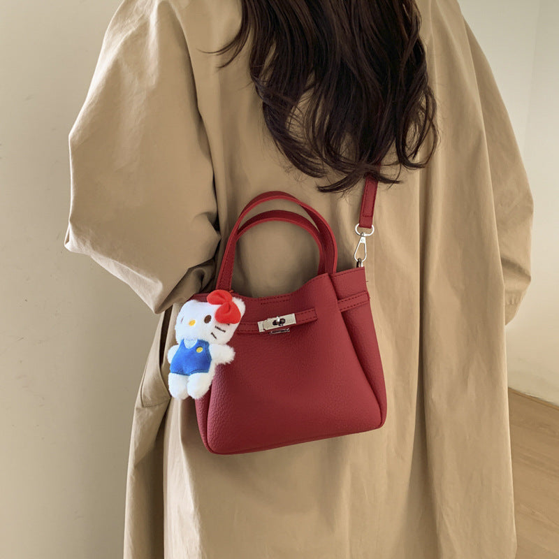 Ladies mini handbag with detachable cosmetic pouch