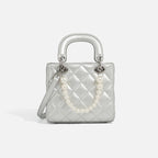 Ladies mini handbag with pearl-embellished chain and quilted design