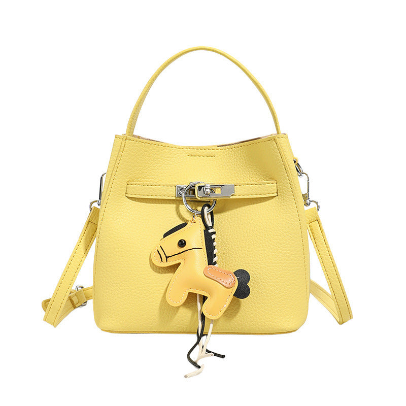 Women’s mini crossbody bag with playful design and cute charm