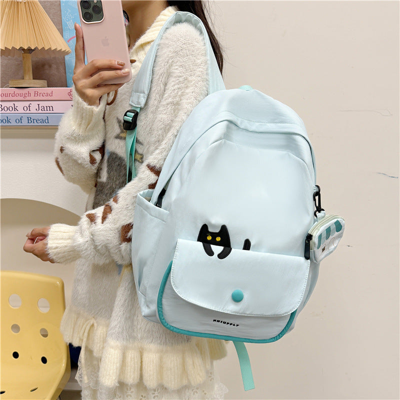 Playful backpack with cat design and versatile compartments