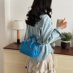 Women’s mini handbag with textured artificial leather and elegant design