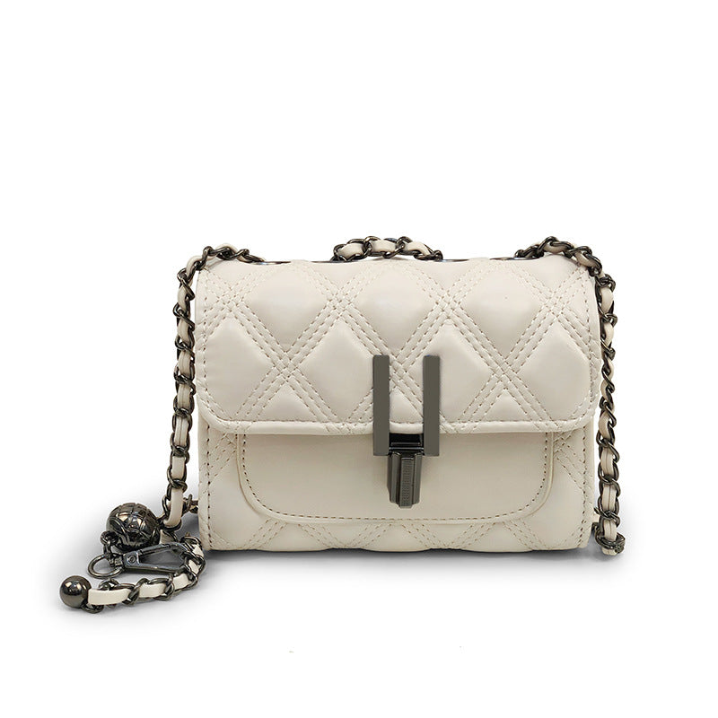 Women’s mini clutch with elegant chain strap and luxurious quilted pattern