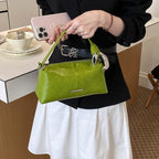 Ladies elegant handbag with minimalist design and noble accents