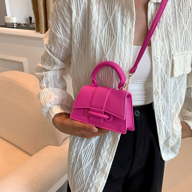 Women's mini handbag with textured leather and stylish closure