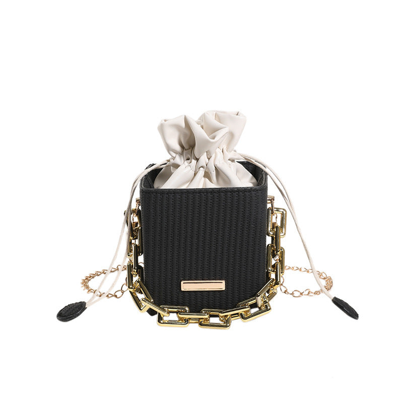 Women's mini handbag with unique chain embellishment and classic drawstring