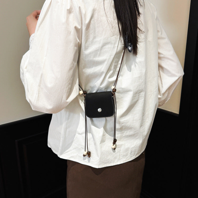 Women's mini handbag with adjustable chain strap and customizable design