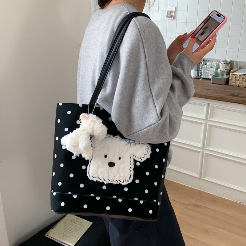 Plush shoulder bag with playful dog motif