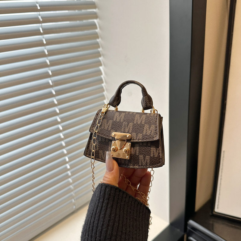 Women's mini handbag with decorative chain strap