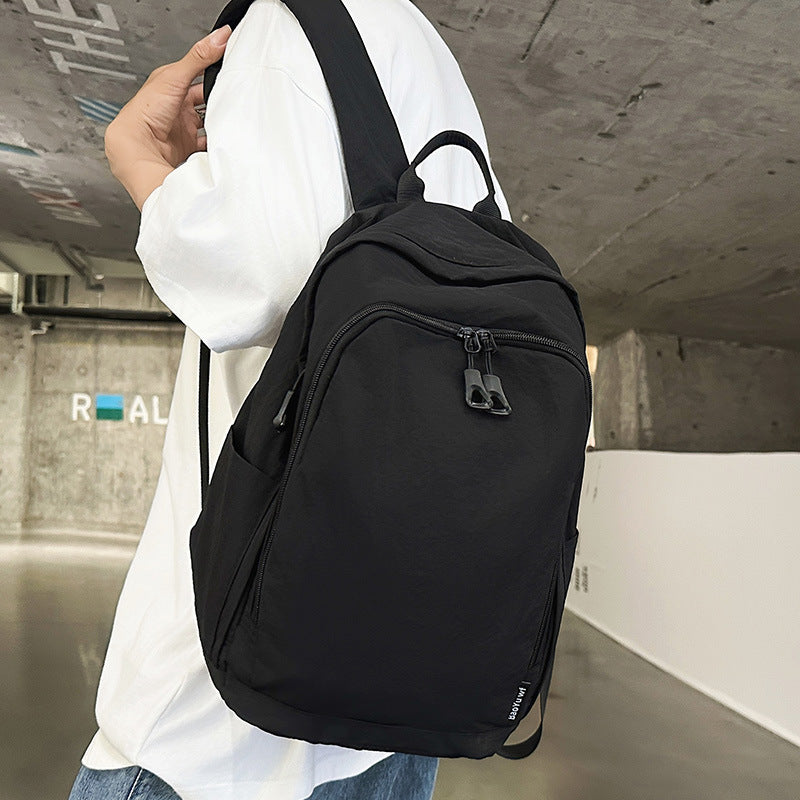 City backpack with versatile compartments and breathable carrying system