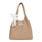 Leisure bag with structured design and playful scarf