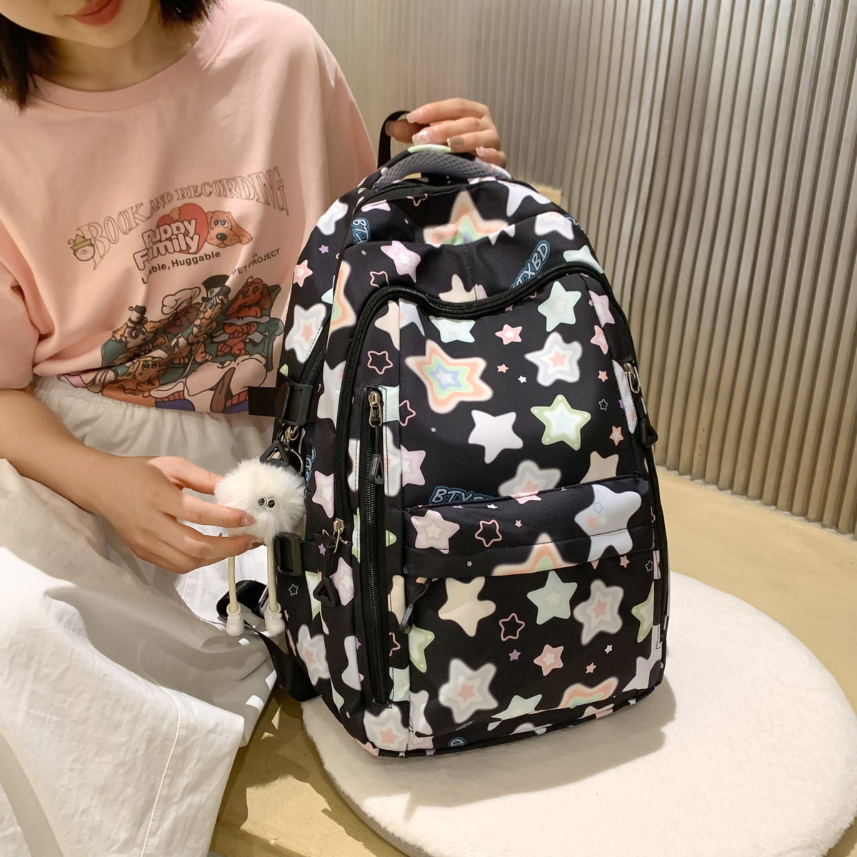 Backpack with Colorful Star Motif and Multifunctional Compartments