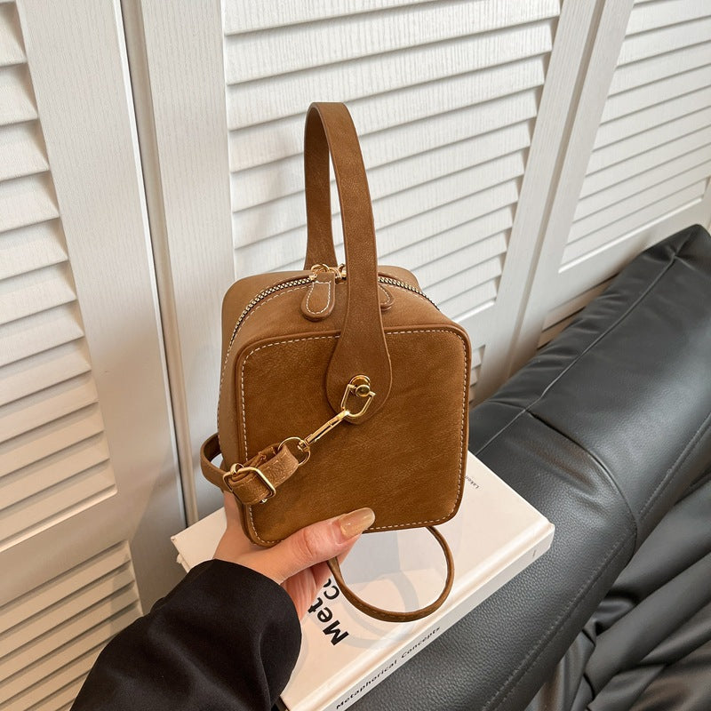 Ladies mini handbag with removable shoulder strap and elegant flap closure