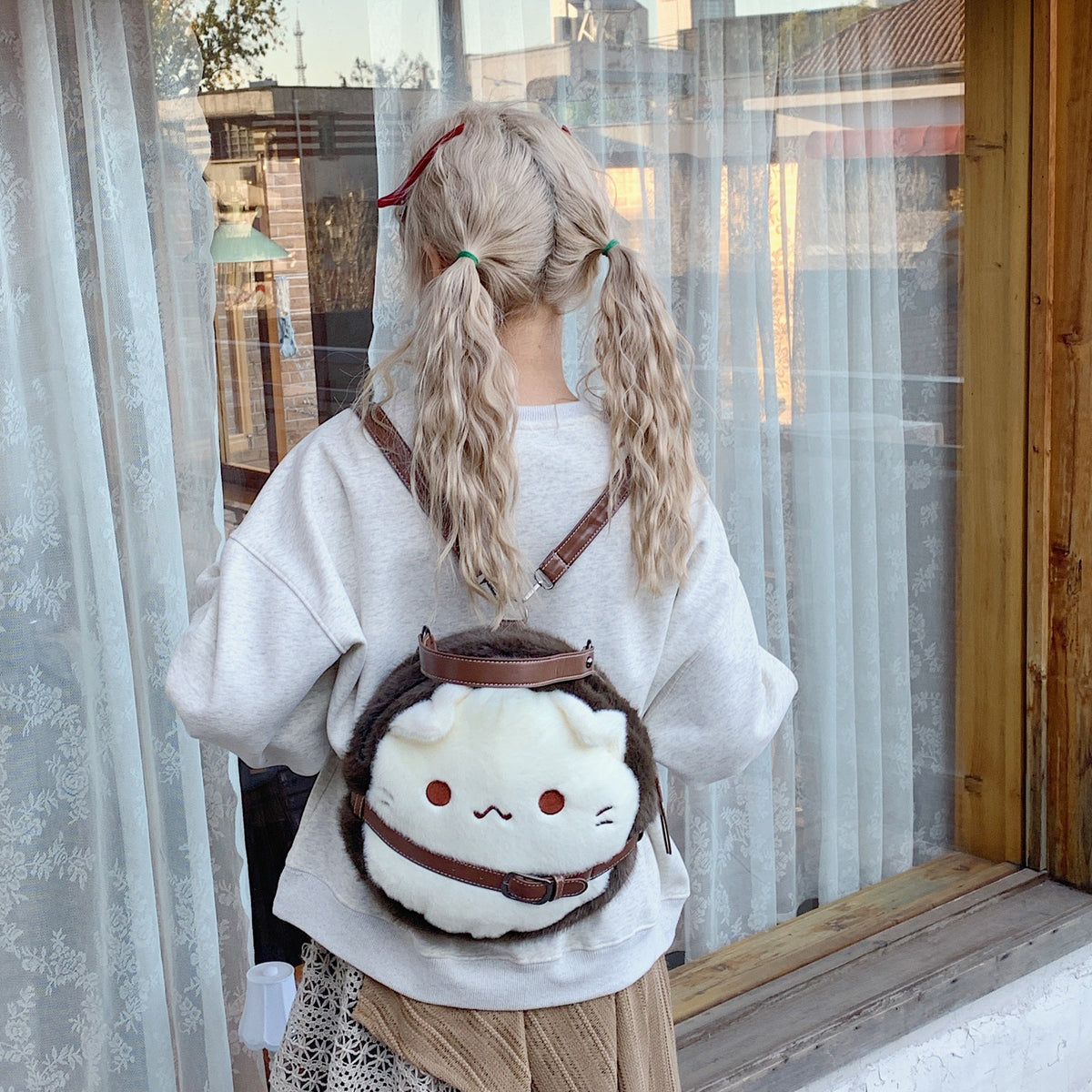 Plush children's backpack with cute cat motif