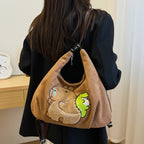 Shoulder bag with playful bear motif