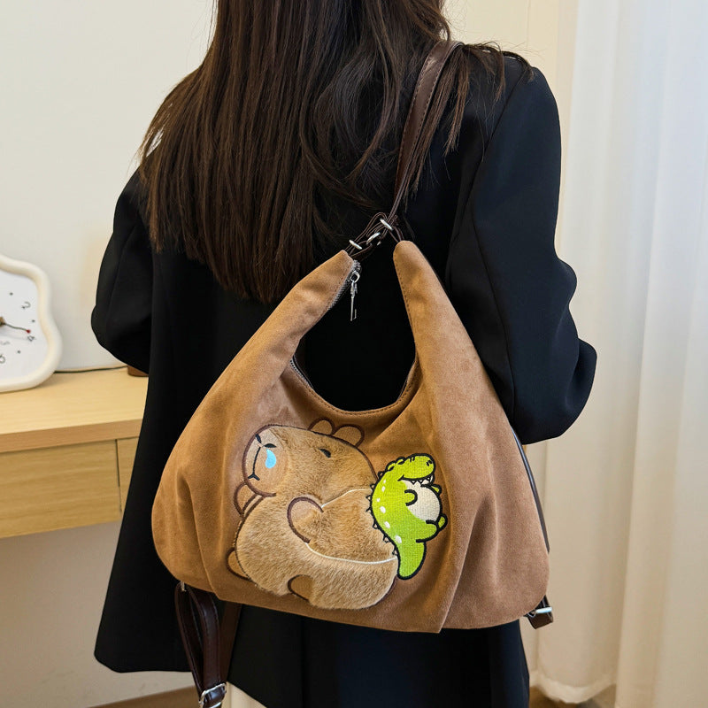 Shoulder bag with playful bear motif