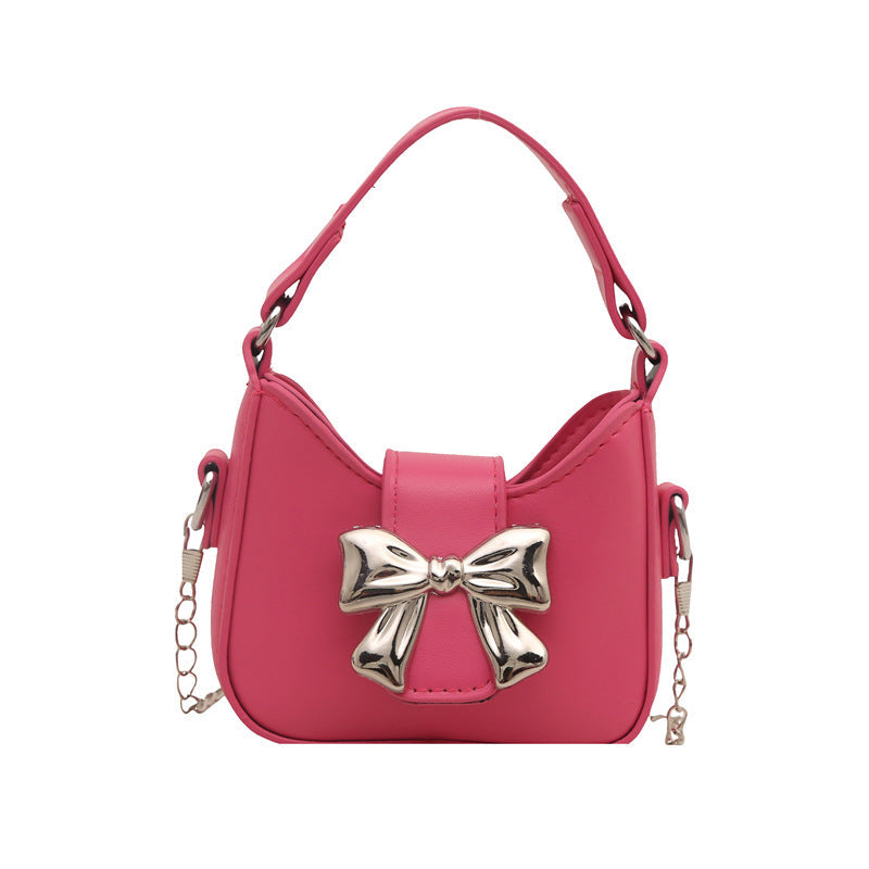 Women’s mini handbag with stylish bow closure