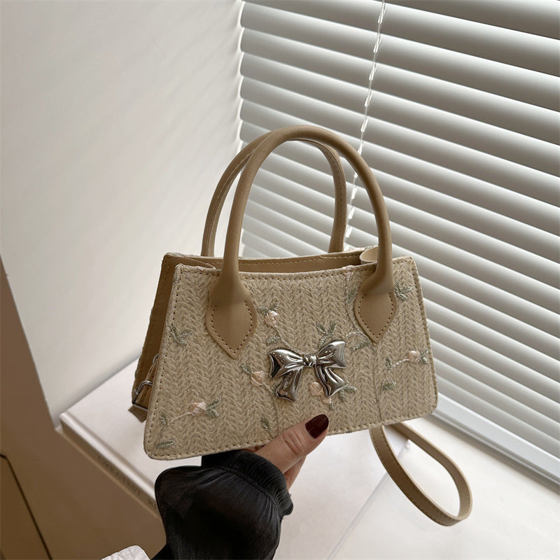 Ladies mini bag with floral woven design and stylish bow detail