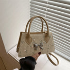 Ladies mini bag with floral woven design and stylish bow detail