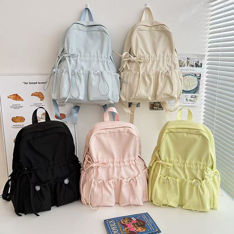 City backpack with innovative compartment system and adjustable carrying straps