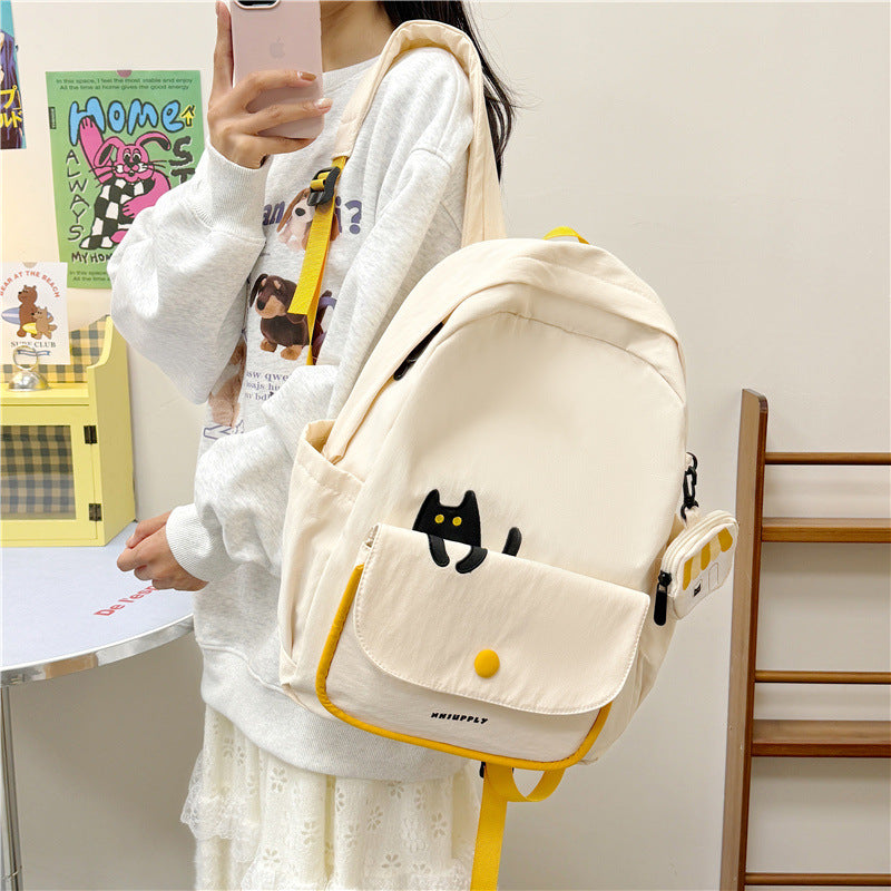 Playful backpack with cat design and versatile compartments