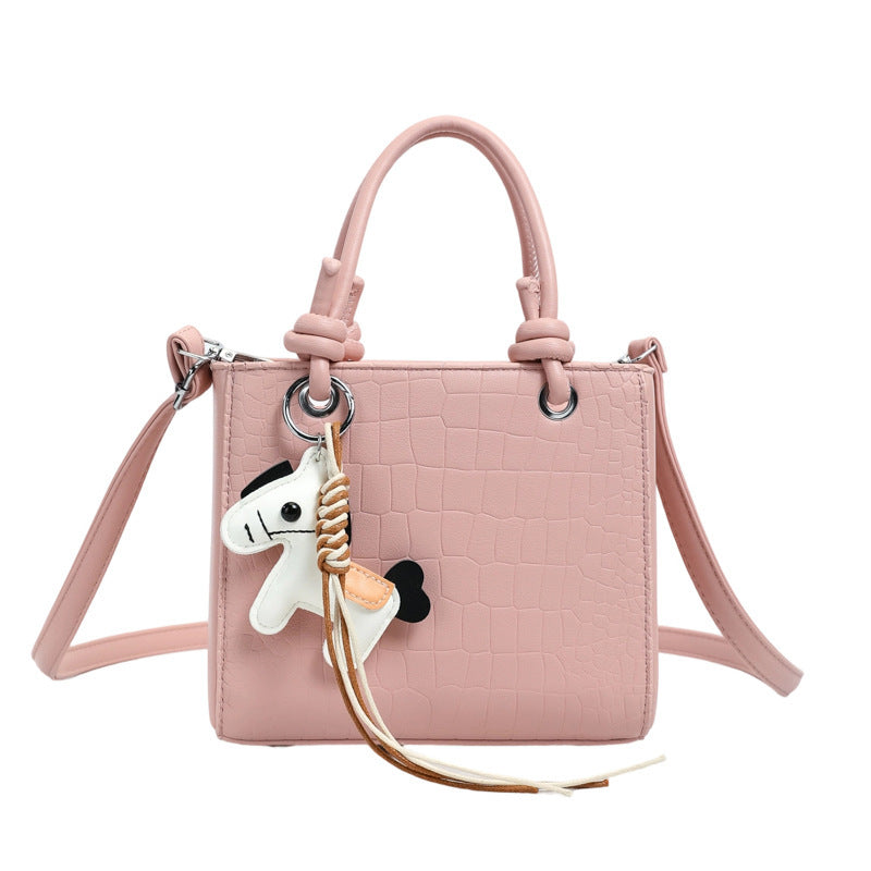 Women's mini bag with animal charm and modern crocodile look