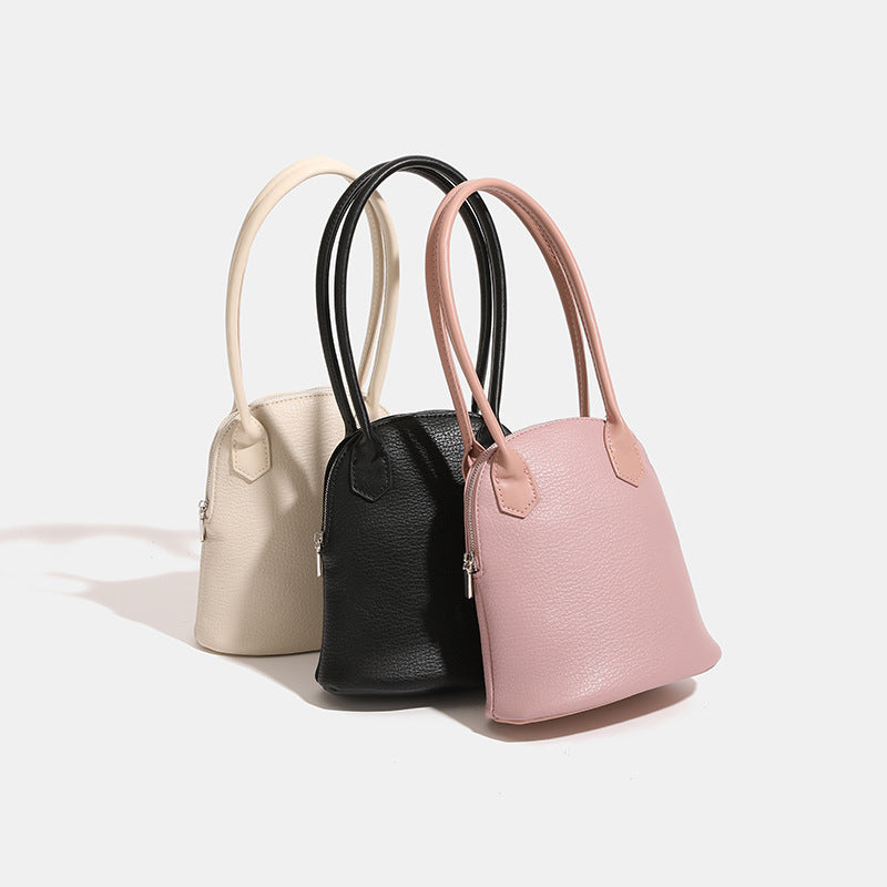 Women's mini handbag in modern design with practical zipper