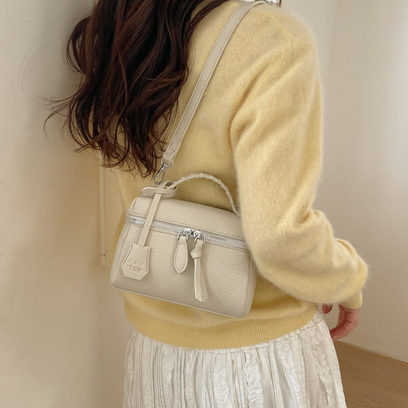 Women's mini handbag with fine decorative seams and detachable shoulder strap