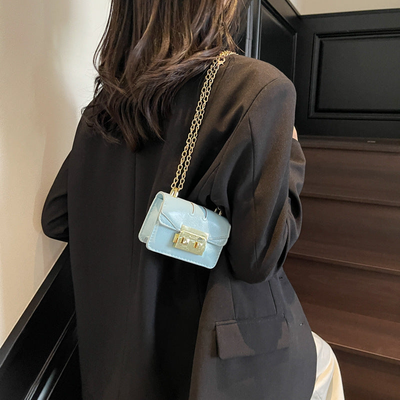 Women's mini handbag with elegant metal accents