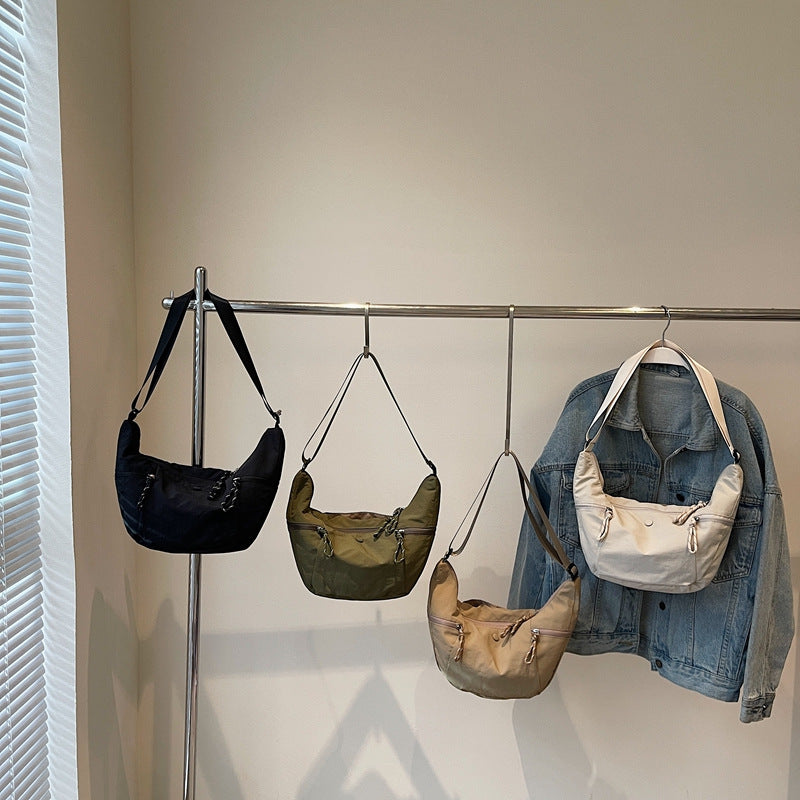 Practical shoulder bag with external zip pockets