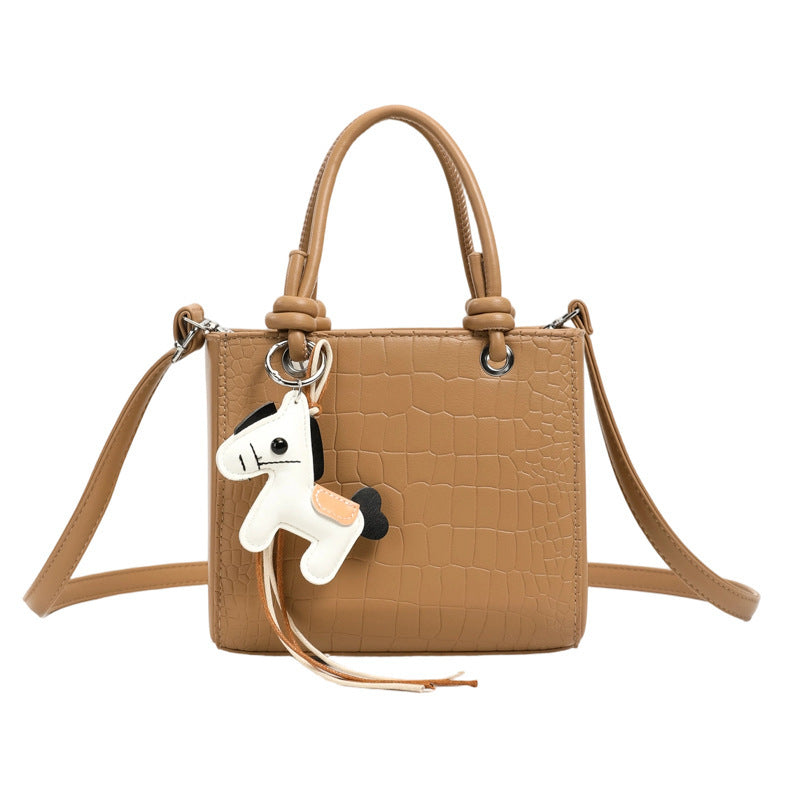 Women's mini bag with animal charm and modern crocodile look