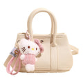 Women’s mini handbag with playful plush pendant