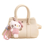 Women’s mini handbag with playful plush pendant