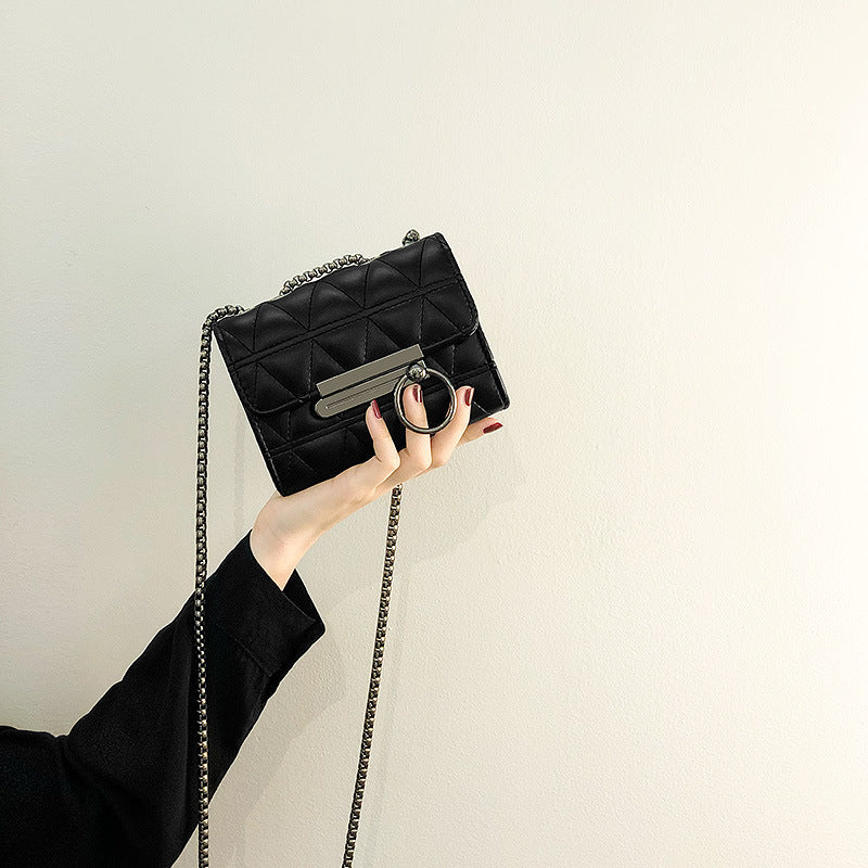 Women's clutch bag with elegant quilting and fine chain strap