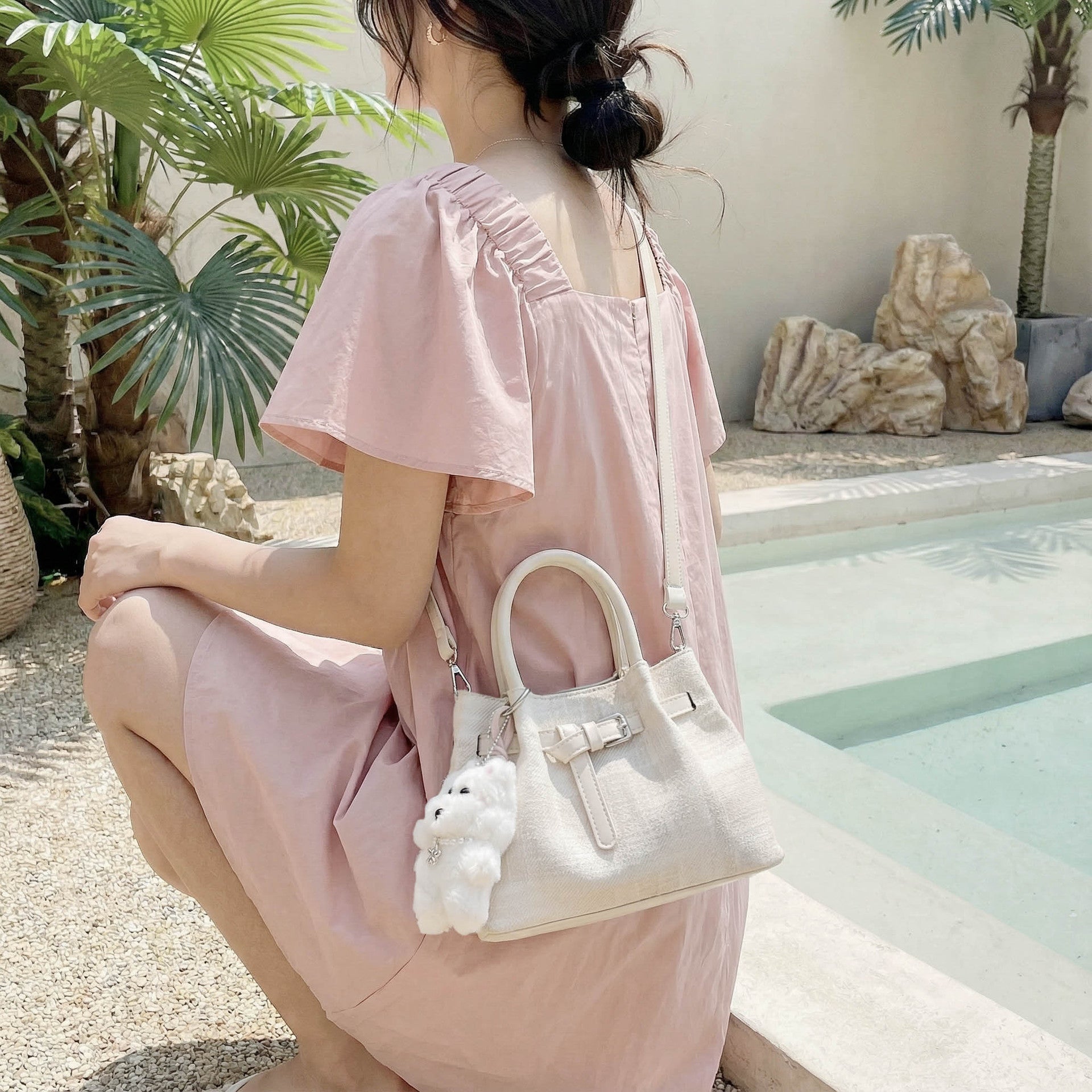 Women’s mini handbag with modern accents and practical interior organizer